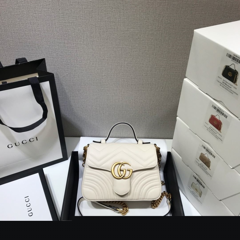 G*u*i top handle bags